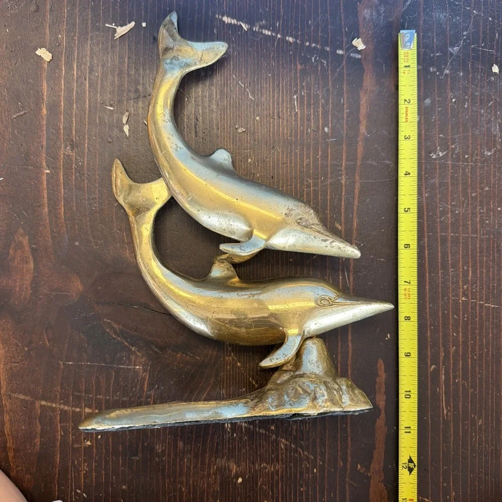 brass dolphin sculpture